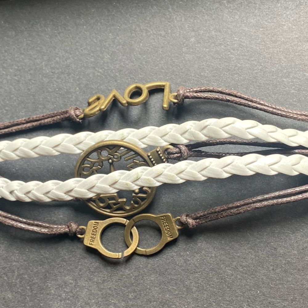 ⚠️ multi strand leather brown/white bracelet w/handcuffs, clock, and love charms